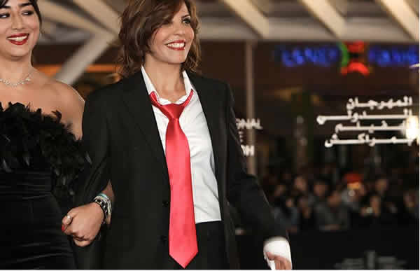 لطيفة أحرار بلباس رجالي